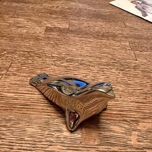 A vintage Dansk stylized aluminum seal paperweight.